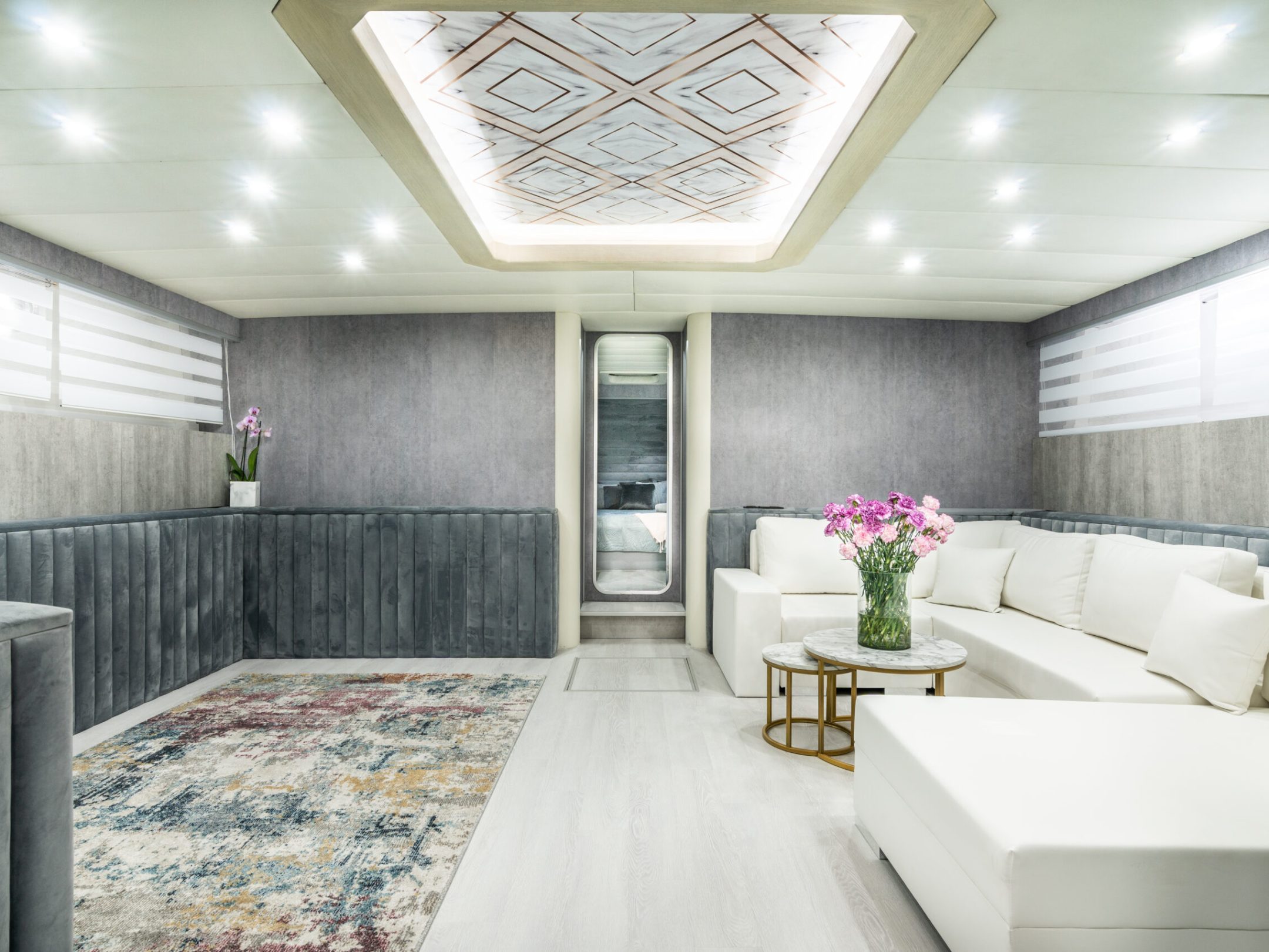 a living room filled with furniture and a large window