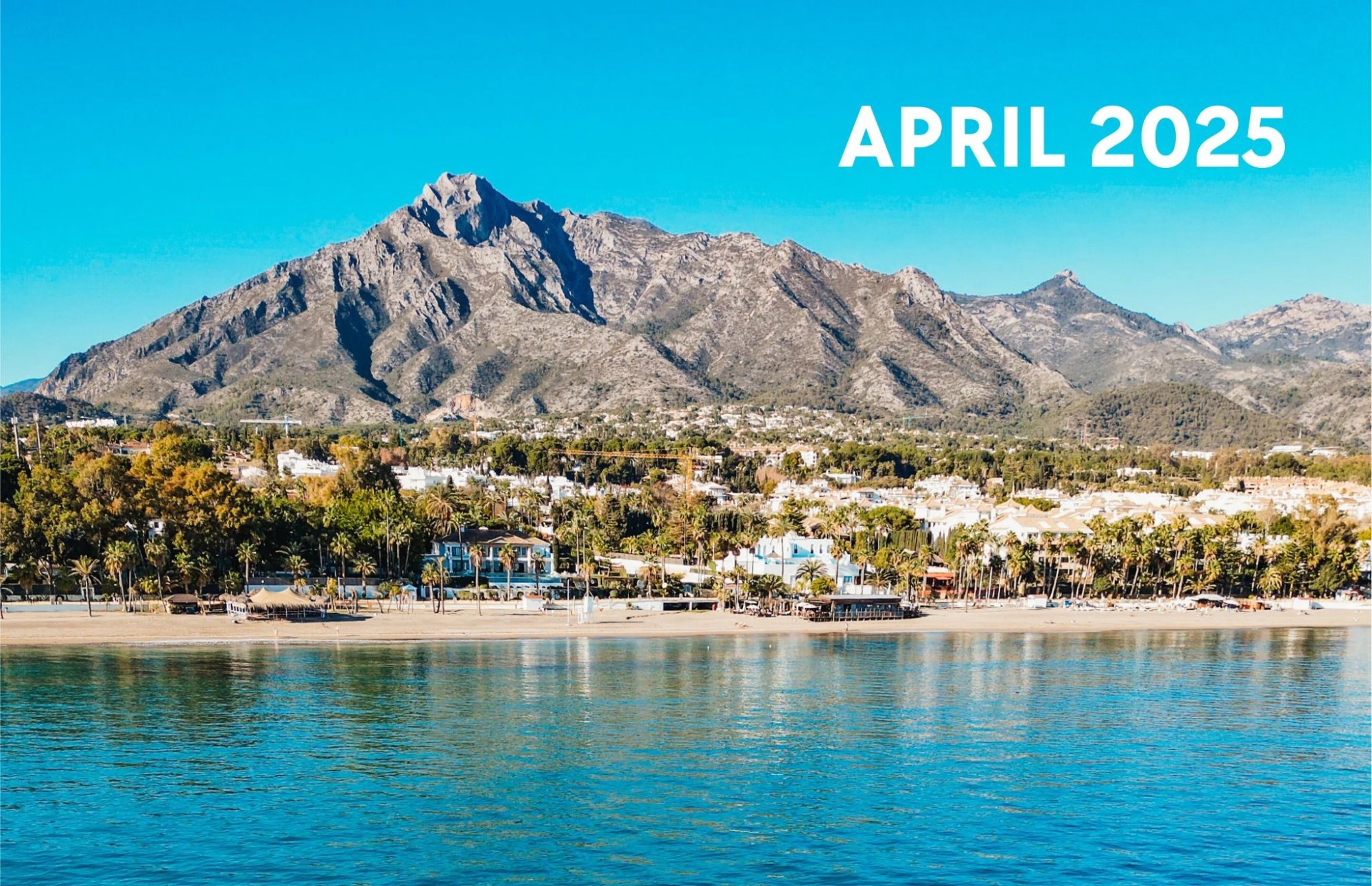 MAY 2025 – 1 a body of water with a mountain in the background