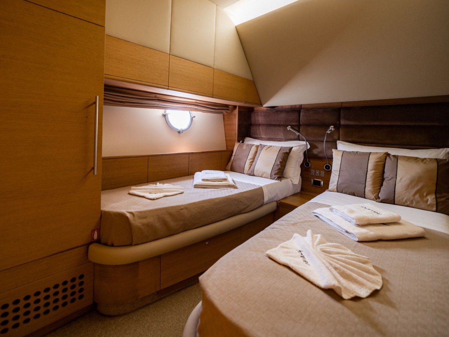 a bedroom with a bed and desk in a room