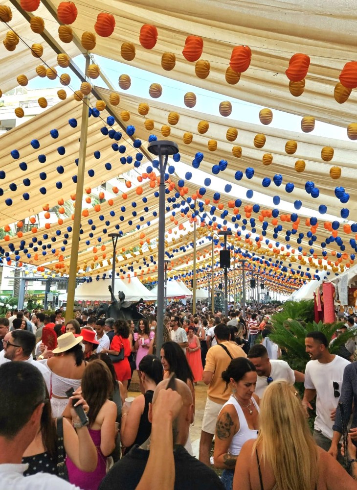 a group of people standing in front of a crowd