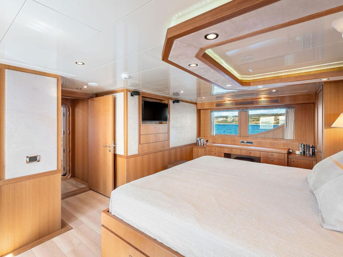 a bedroom with a large bed in a room