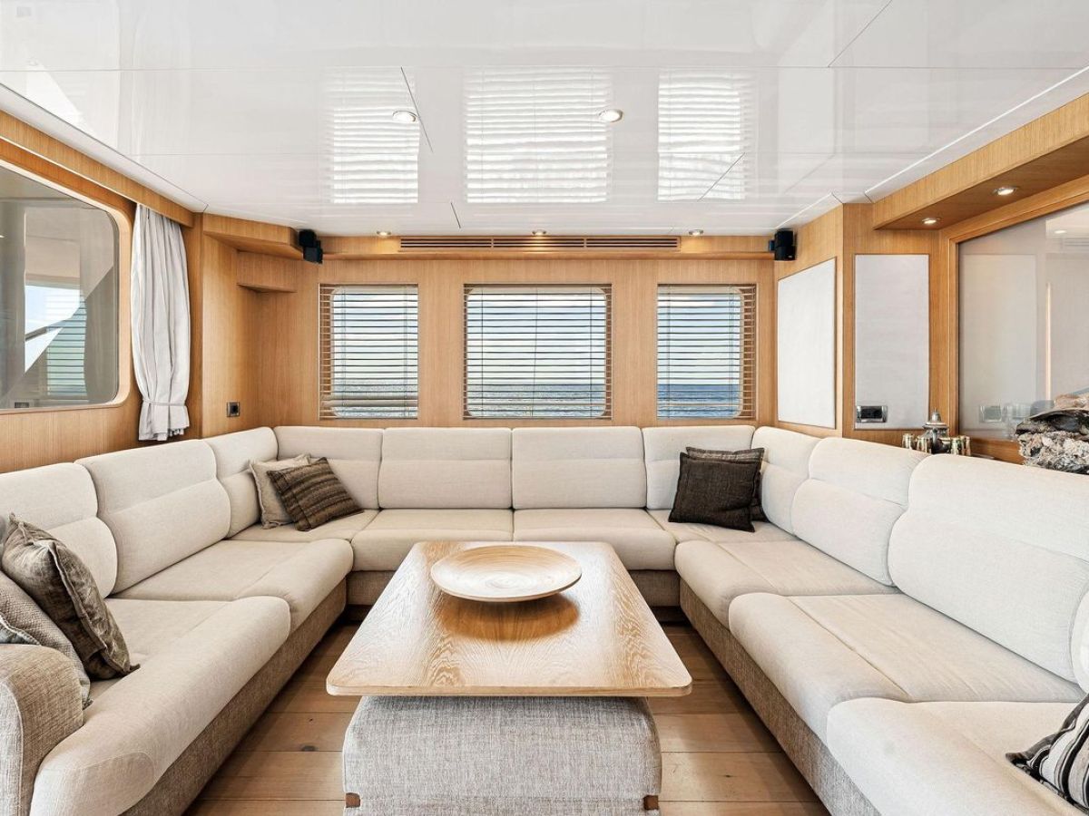 a living room filled with furniture and a large window
