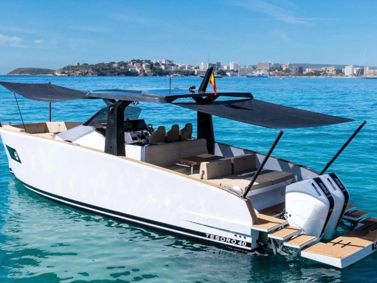 a boat sitting next to a body of water