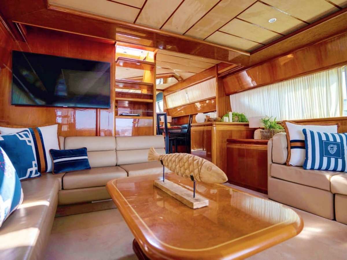 a living room filled with furniture and a large window