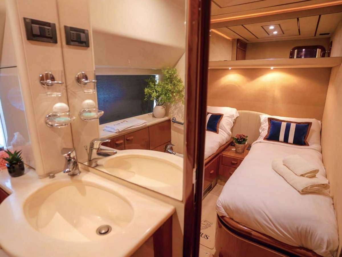 a hotel room with a sink and a mirror