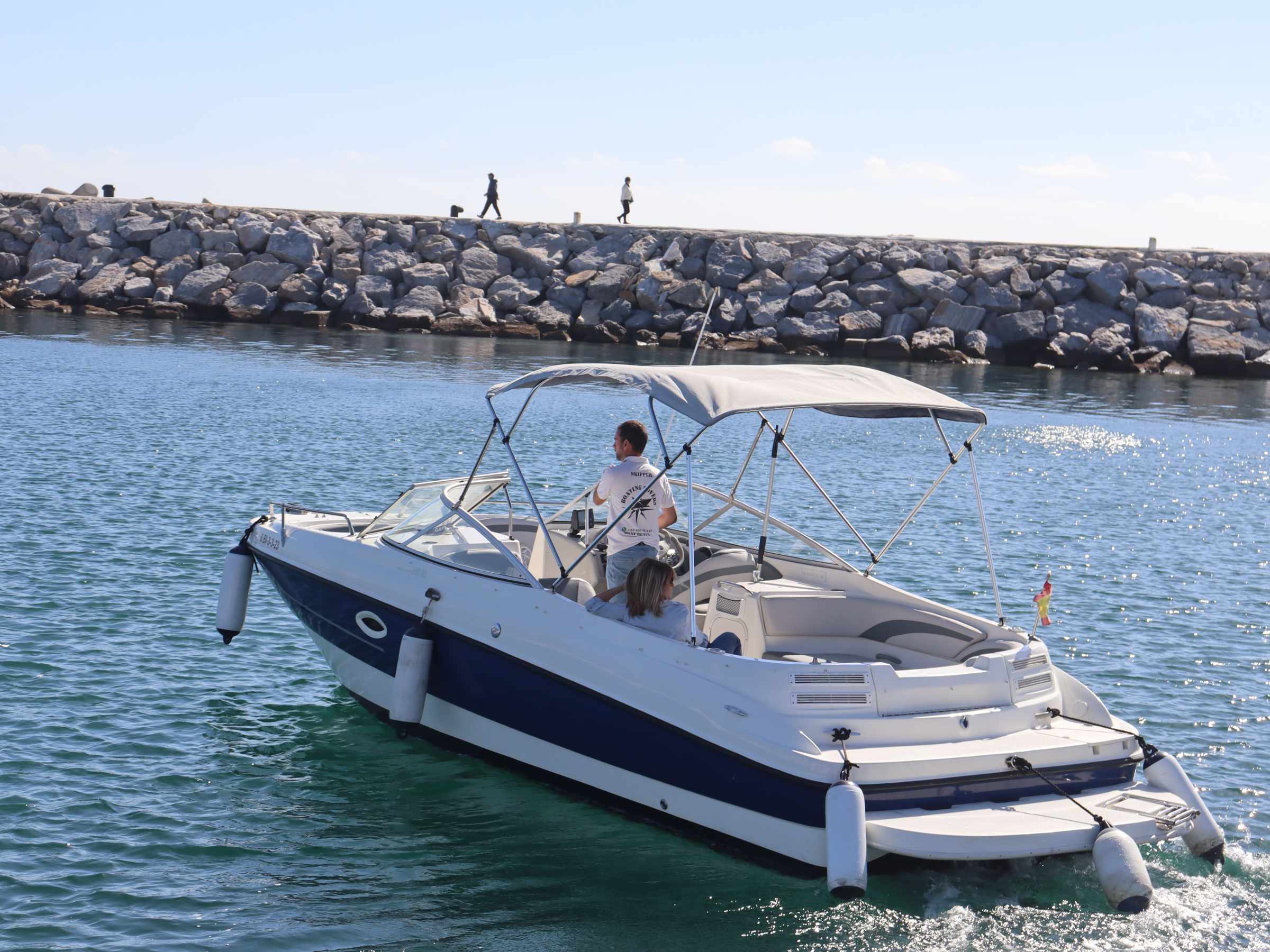 a small boat in a large body of water
