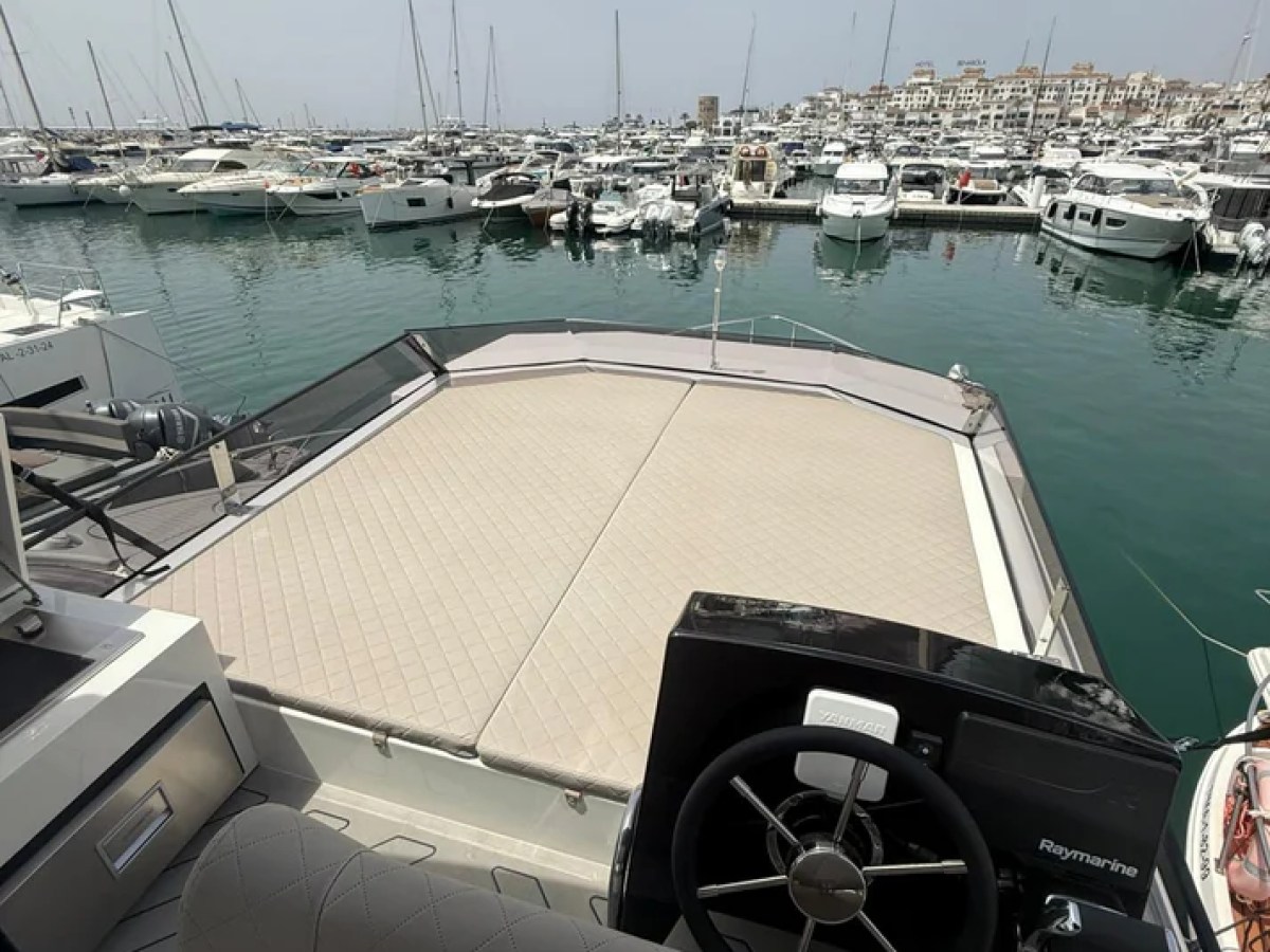 a boat is docked next to a body of water