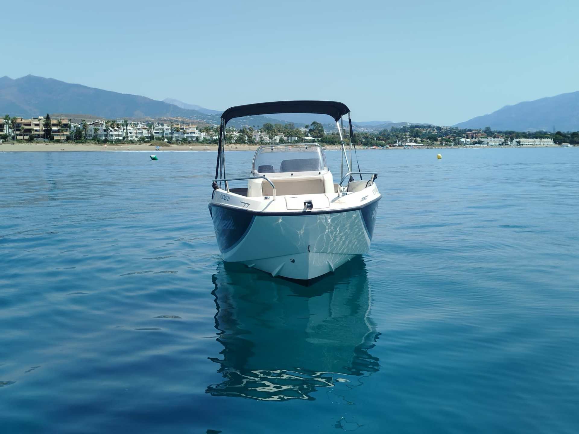 a small boat in a body of water