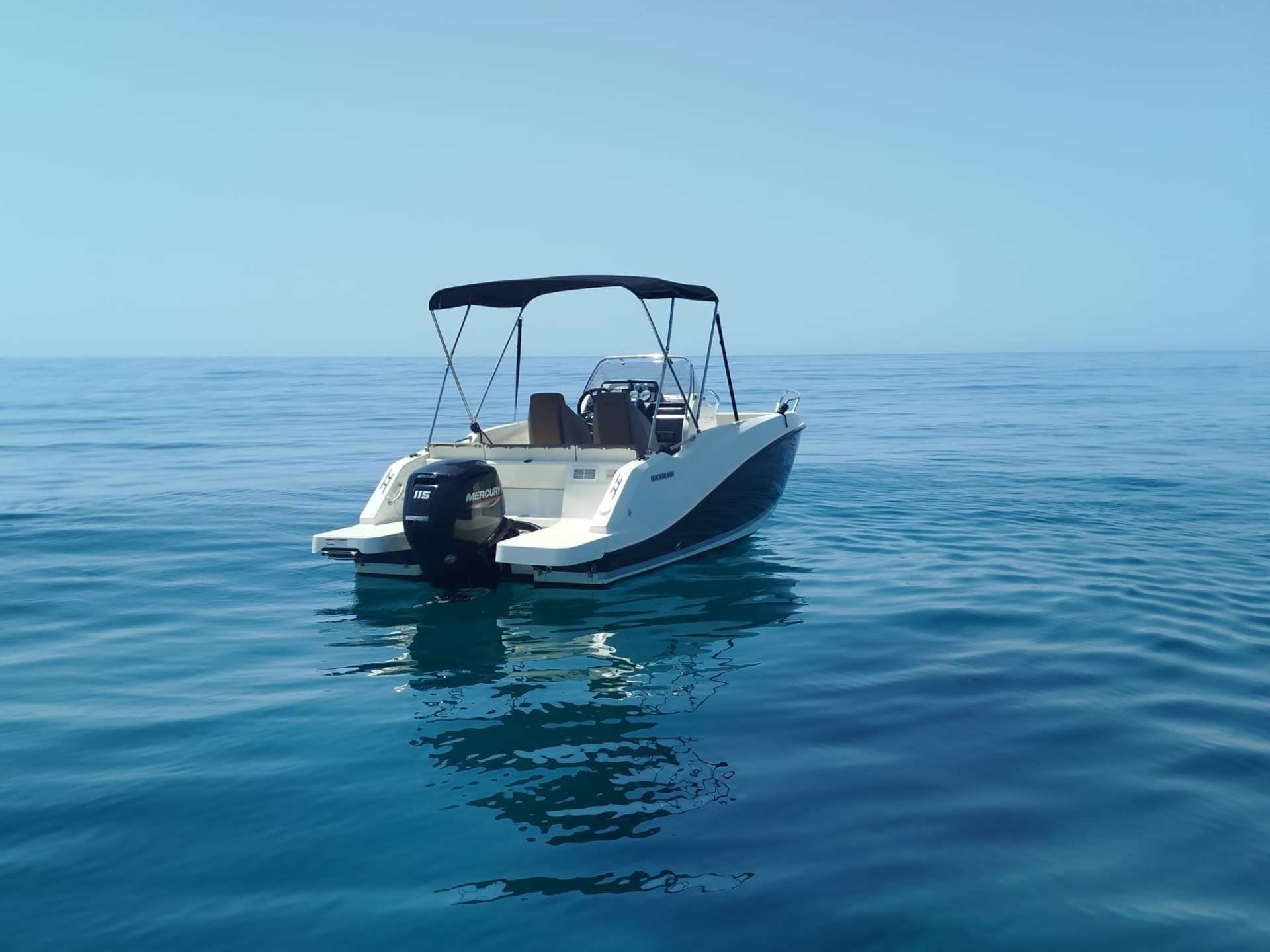 a small boat in a body of water